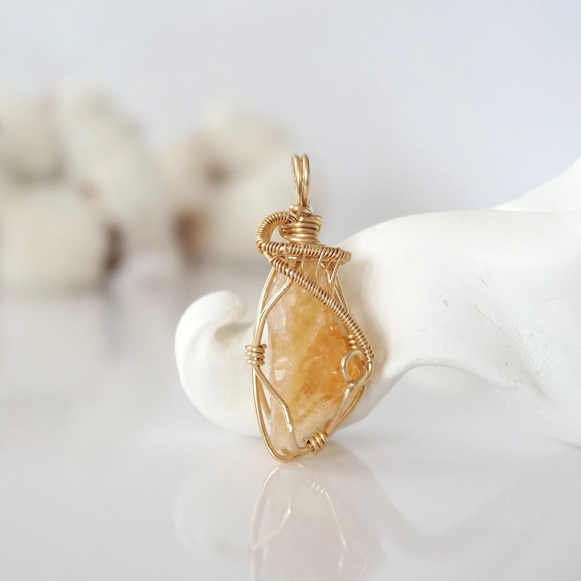 Detailed front view of raw citrine pendant in 14k gold filled. Unique wire wrapped November birthstone jewelry by Designs by Nature Gems.