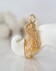 Side view of raw citrine pendant in 14k gold filled, showing artisan wire wrapping. Handcrafted November birthstone necklace by Designs by Nature Gems.