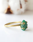 Left side view of raw emerald ring in gold vermeil with adjustable band and handcrafted artisan details