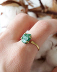 Raw emerald adjustable ring in gold vermeil worn on a woman's hand, natural May birthstone ring for women