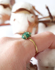 Natural raw emerald ring in gold vermeil on female hand, adjustable artisan gemstone ring for women