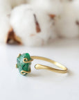Right side detail of natural raw emerald ring in gold vermeil with adjustable artisan ring design