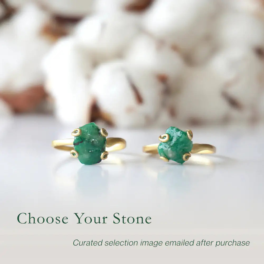 Two raw emerald adjustable rings in gold vermeil showing natural variation in emerald size, shape, and green colour