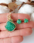 Raw emerald necklace and stud earrings set in 14k gold filled shown in hand for size reference. Artisan May birthstone jewelry set by Designs by Nature Gems.