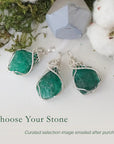 Three raw emerald pendants for women showing natural variation in emerald size, shape, and green colour in sterling silver wire wrapping