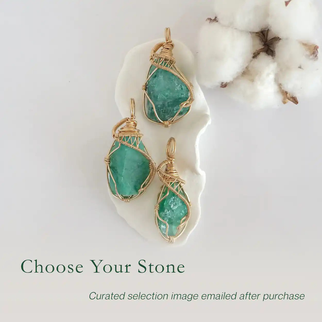 Three raw emerald pendants in 14k gold filled, showing natural variation in size, shape, and color. Handcrafted May birthstone jewelry by Designs by Nature Gems.