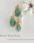 Three raw emerald pendants in 14k gold filled, showing natural variation in size, shape, and color. Handcrafted May birthstone jewelry by Designs by Nature Gems.