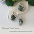 Three raw emerald pendants showing natural variation in size, shape, and green colour by Designs by Nature Gems.