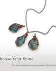 Three raw emerald pendants showing natural variation in size, shape, and green colour by Designs by Nature Gems.