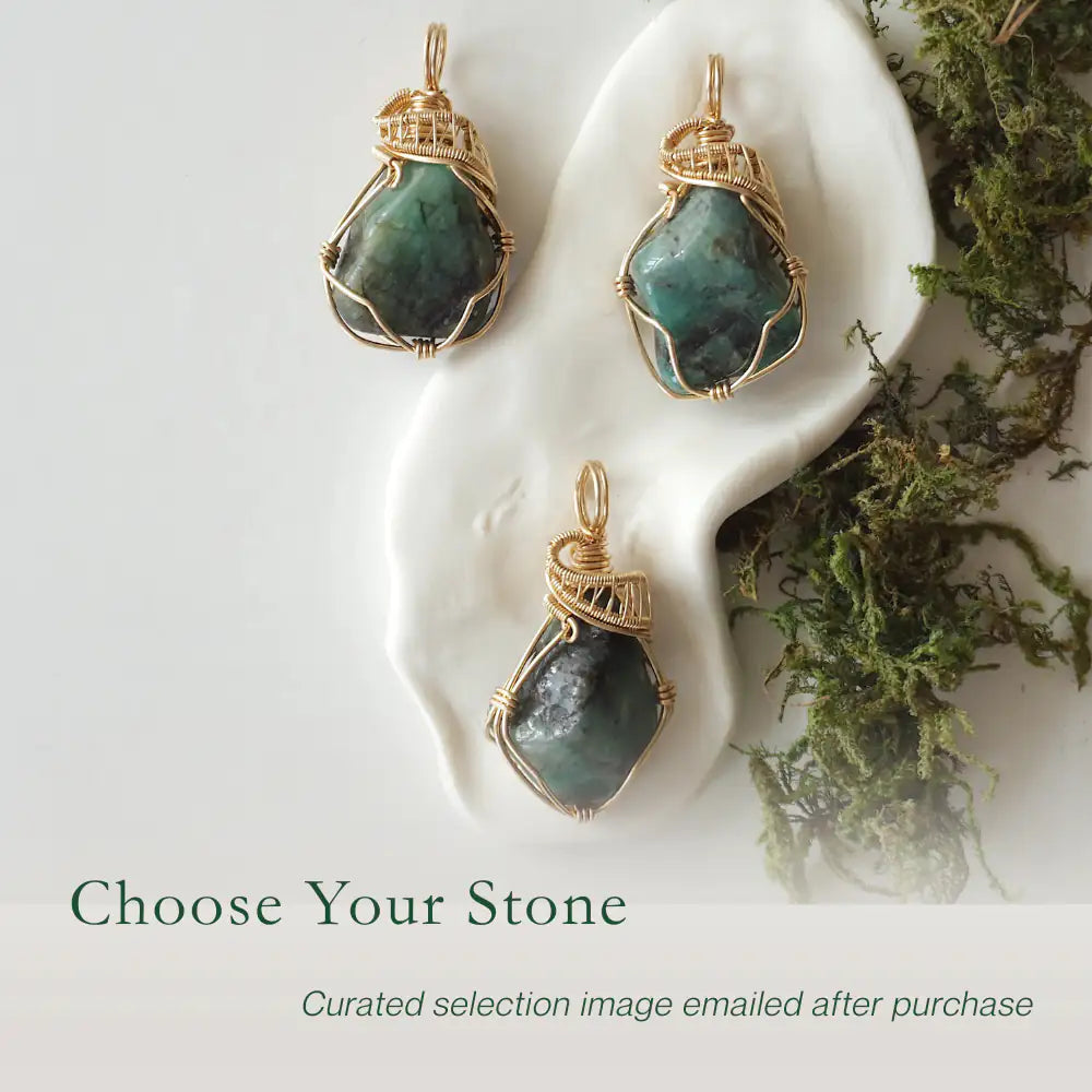 Three raw emerald pendants showing natural variation in size, shape, and green colour by Designs by Nature Gems.