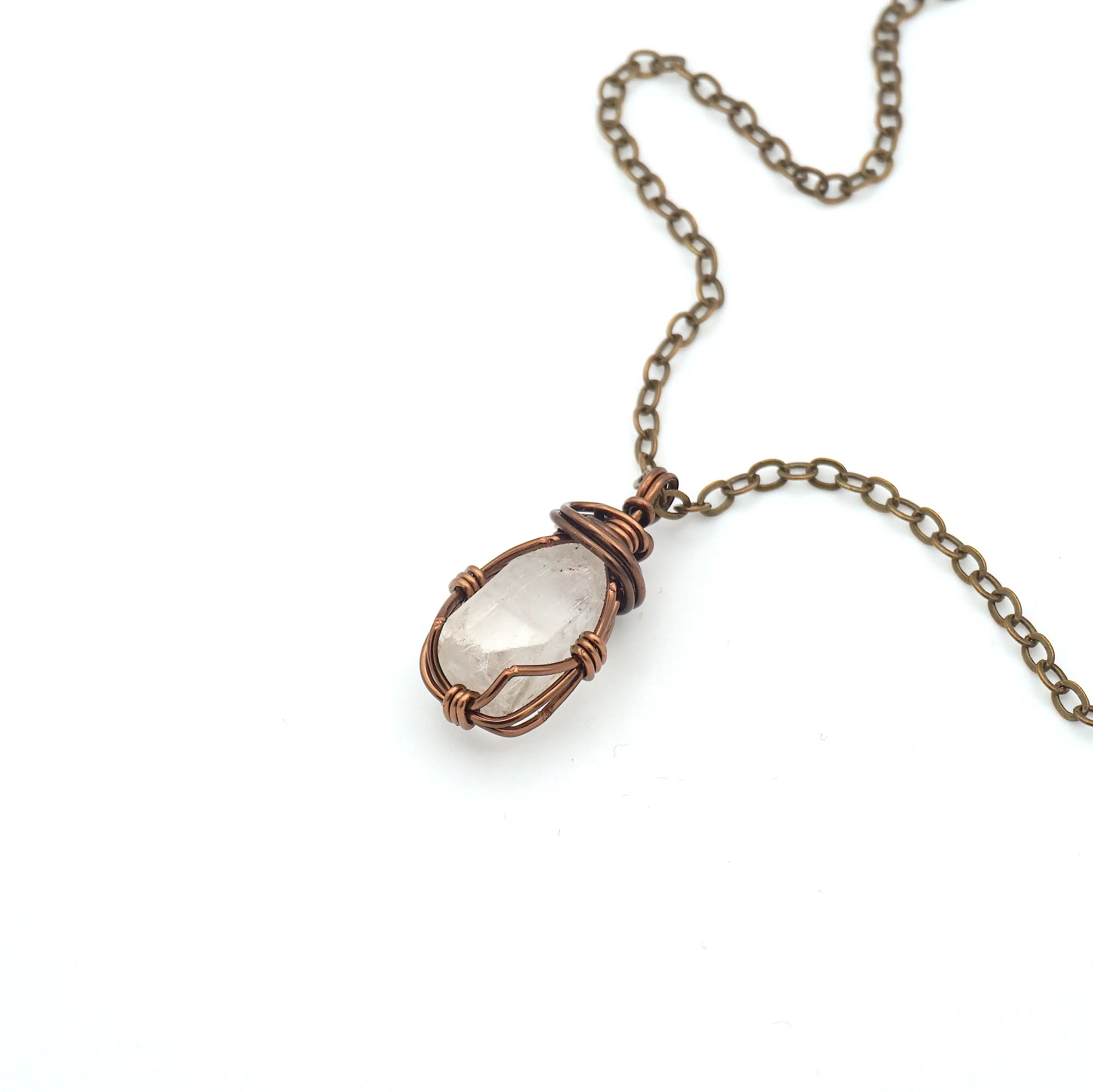 Raw Herkimer diamond necklace wrapped in antique bronze copper, detailed view of handmade April birthstone pendant for all genders.