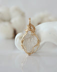 Back view of raw Herkimer diamond pendant in 14k gold filled, highlighting stone and wire detail. One of a kind April birthstone jewelry by Designs by Nature Gems.