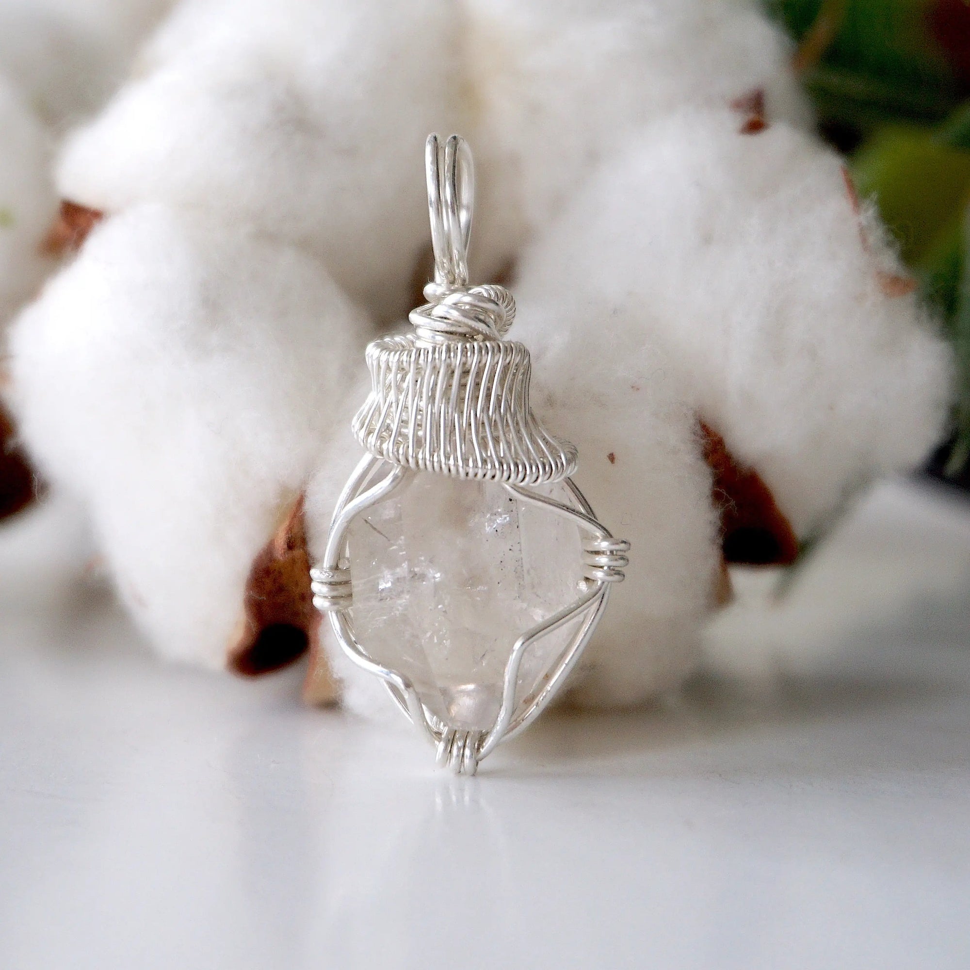 Front view of raw Herkimer diamond pendant for women with detailed artisan wire wrapping in 925 sterling silver.