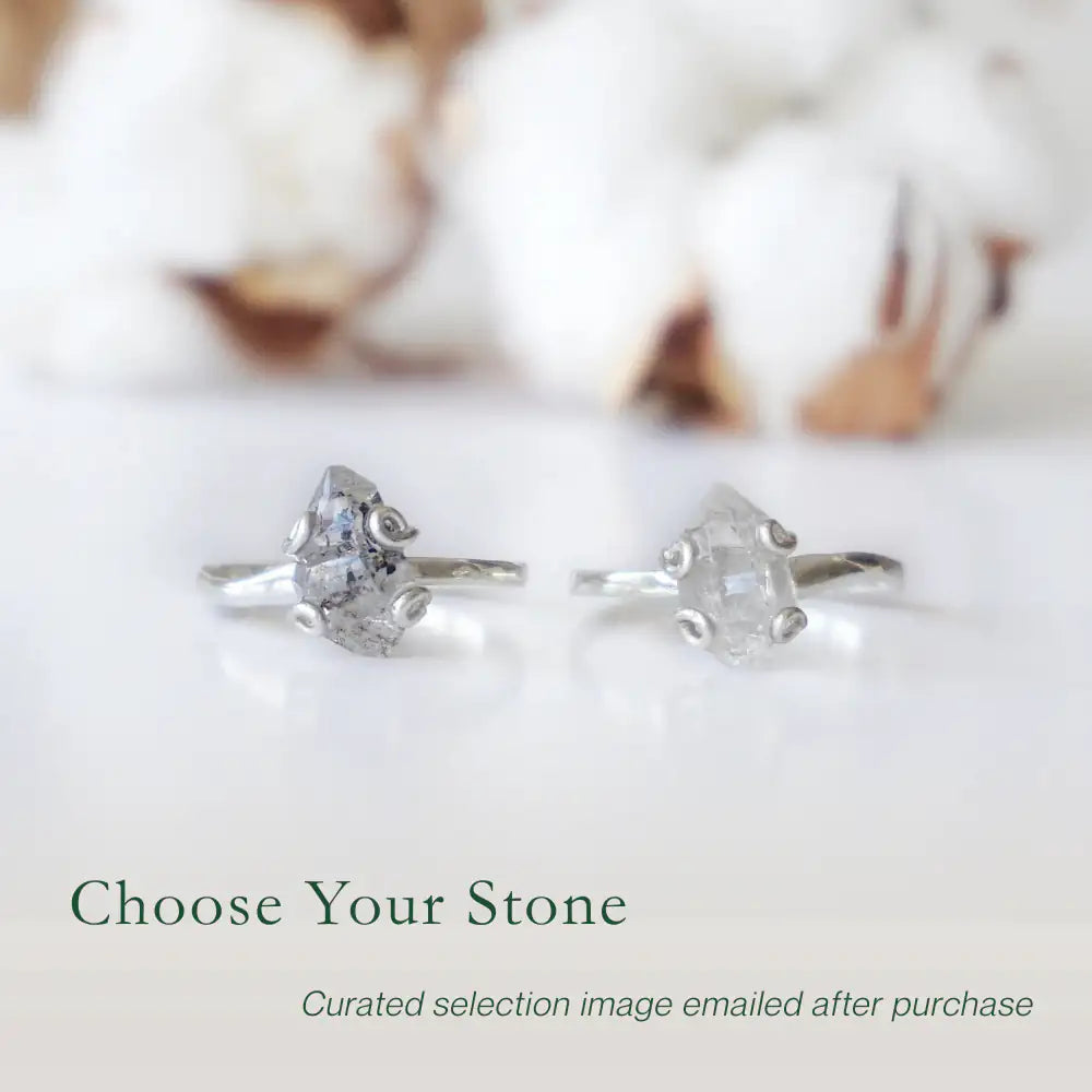Two adjustable raw Herkimer diamond rings in 925 sterling silver showing natural variation in stone size and shape.