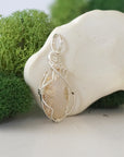 Right side detail of raw opal crystal pendant — intricate 925 sterling silver wire weaving technique, handcrafted artisan wire wrapped jewelry, Designs by Nature Gems