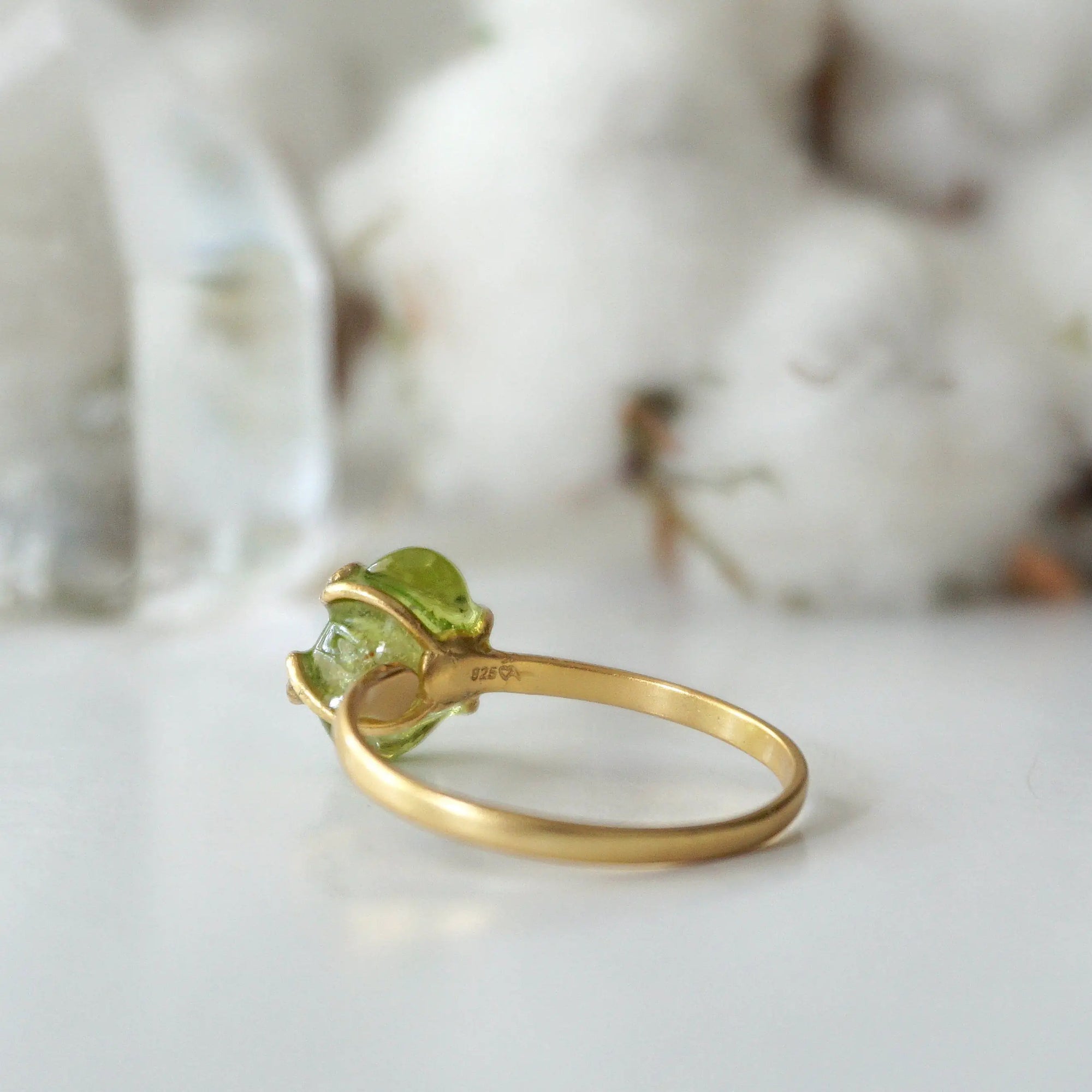 Back view of raw peridot adjustable ring showing open-back gold vermeil band — fits US sizes 4–10, handmade artisan August birthstone crystal ring for women
