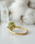 Back view of raw peridot adjustable ring showing open-back gold vermeil band — fits US sizes 4–10, handmade artisan August birthstone crystal ring for women