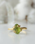 Front detail of raw peridot adjustable ring — vivid olive green natural crystal in 14k gold vermeil artisan setting, handcrafted August birthstone ring for women