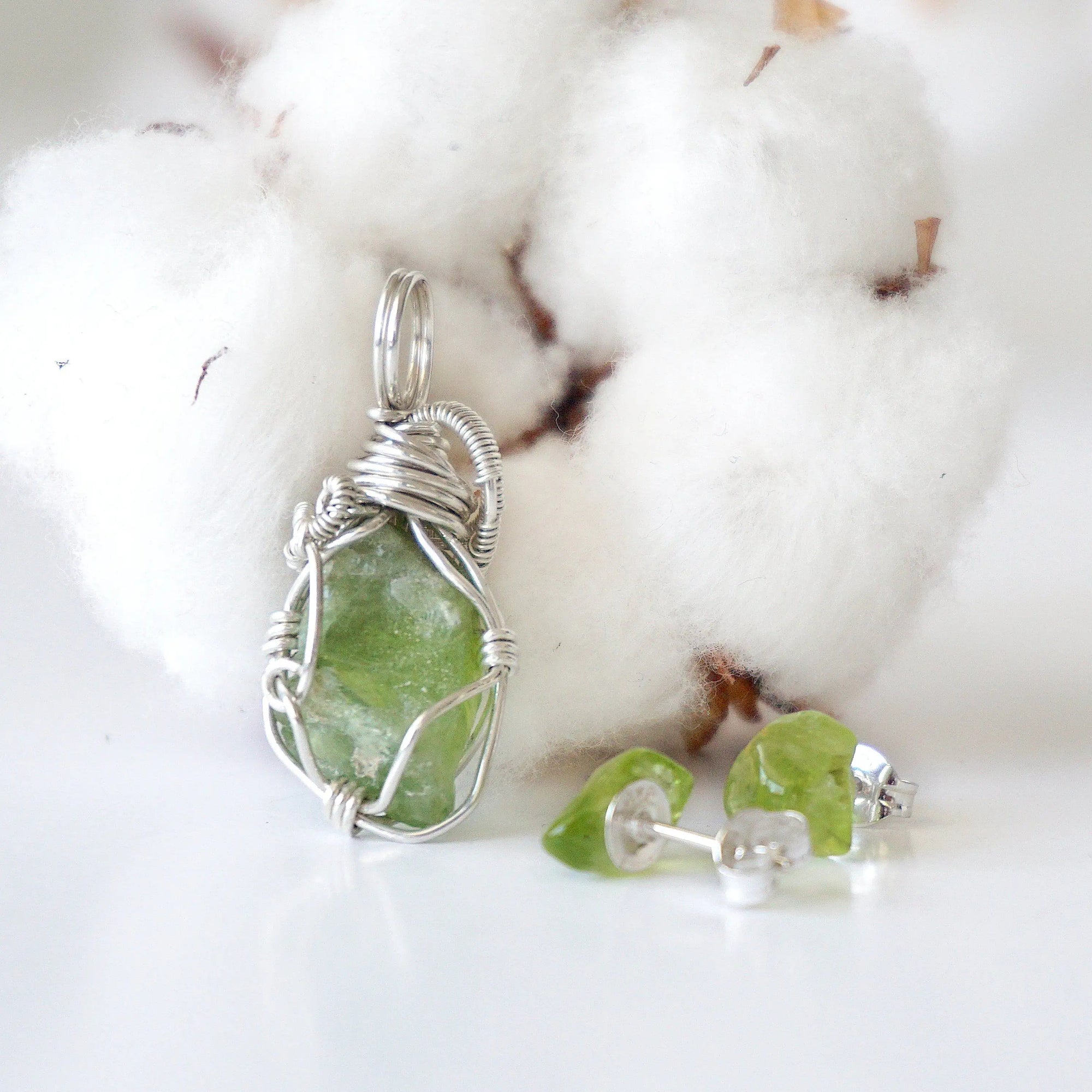 Back view of raw peridot wire wrapped pendant and stud earrings — 925 sterling silver wire weave detail, handcrafted artisan crystal jewelry set, August birthstone