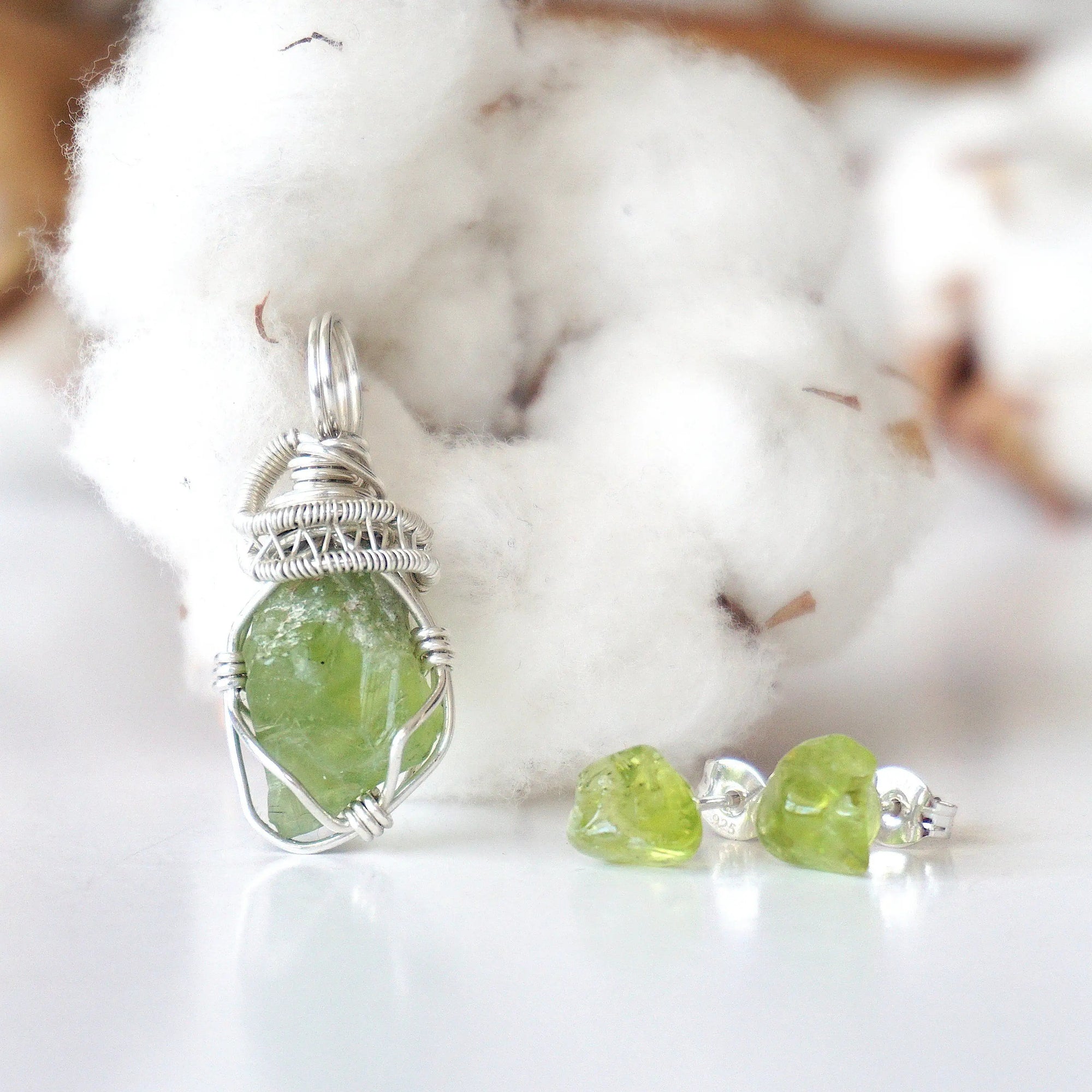 Front view of raw peridot jewelry set for women — sterling silver wire wrapped pendant and matching stud earrings, handcrafted August birthstone crystal set