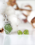 Right side detail of raw peridot pendant and stud earrings — 925 sterling silver wire wrapping artistry, handcrafted August birthstone jewelry set for women by Designs by Nature Gems