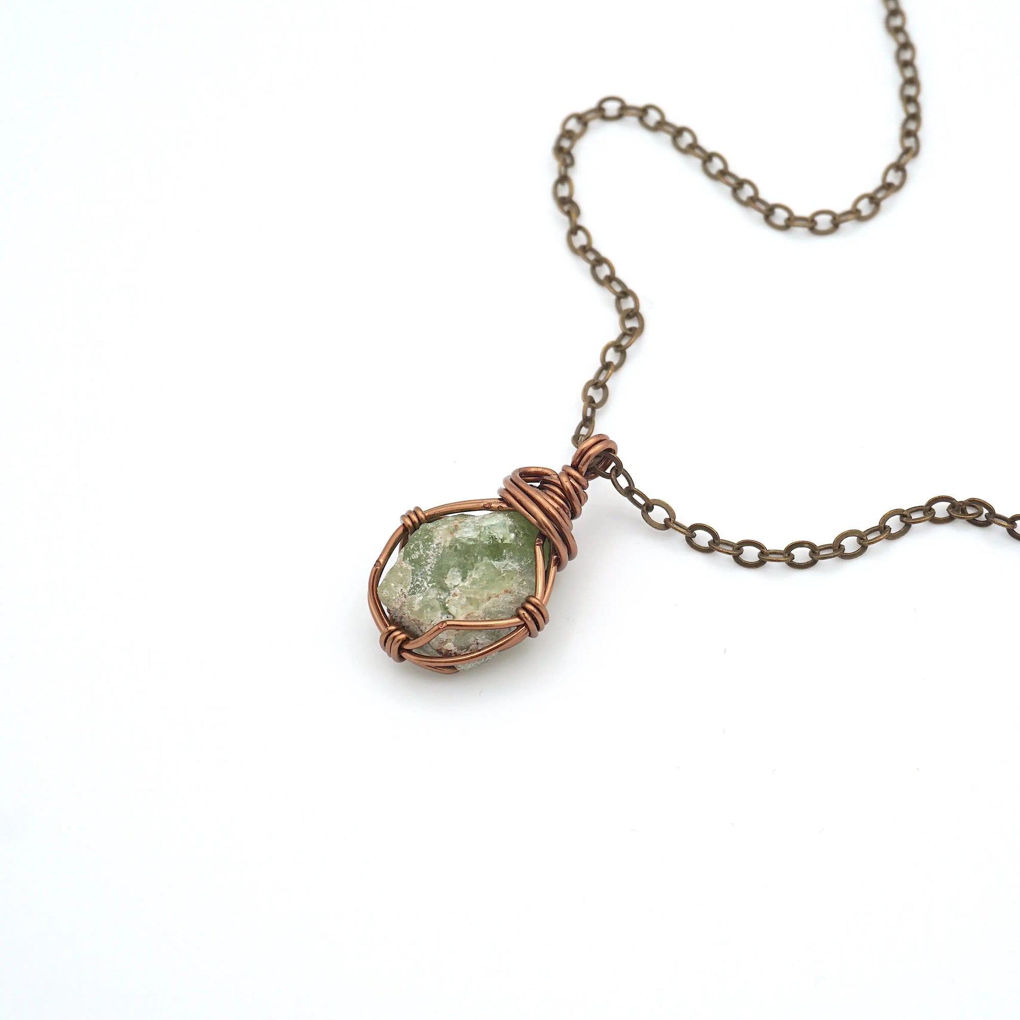 Raw peridot necklace on antique bronze cable chain — handmade August birthstone crystal pendant by Designs by Nature Gems