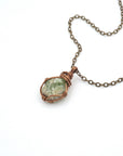 Raw peridot necklace on antique bronze cable chain — handmade August birthstone crystal pendant by Designs by Nature Gems