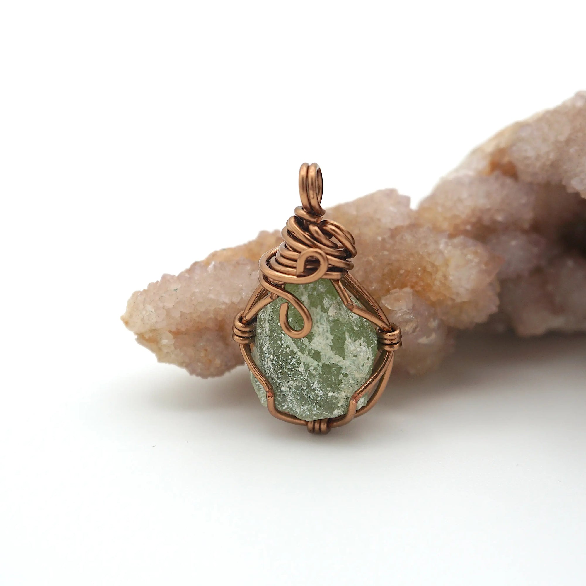 Back view of raw peridot wire wrapped pendant — antique bronze copper wire weave detail, handcrafted artisan crystal necklace