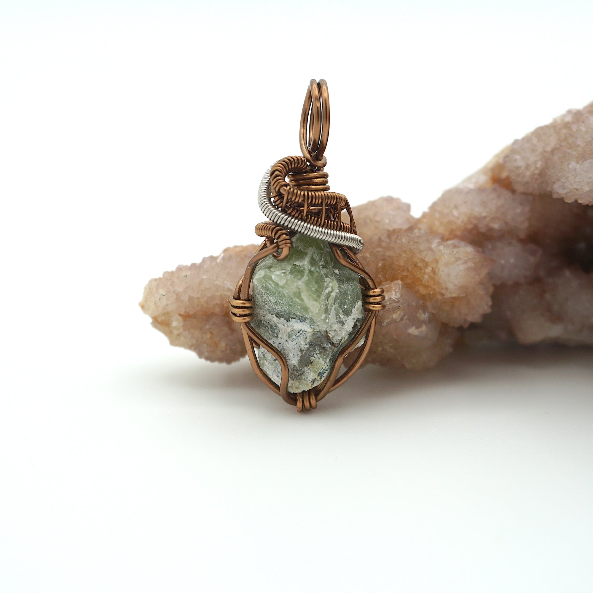 Front view of raw peridot pendant for men — natural sage olive green crystal with pale markings, antique bronze and dark silver wire wrap, handcrafted August birthstone jewelry