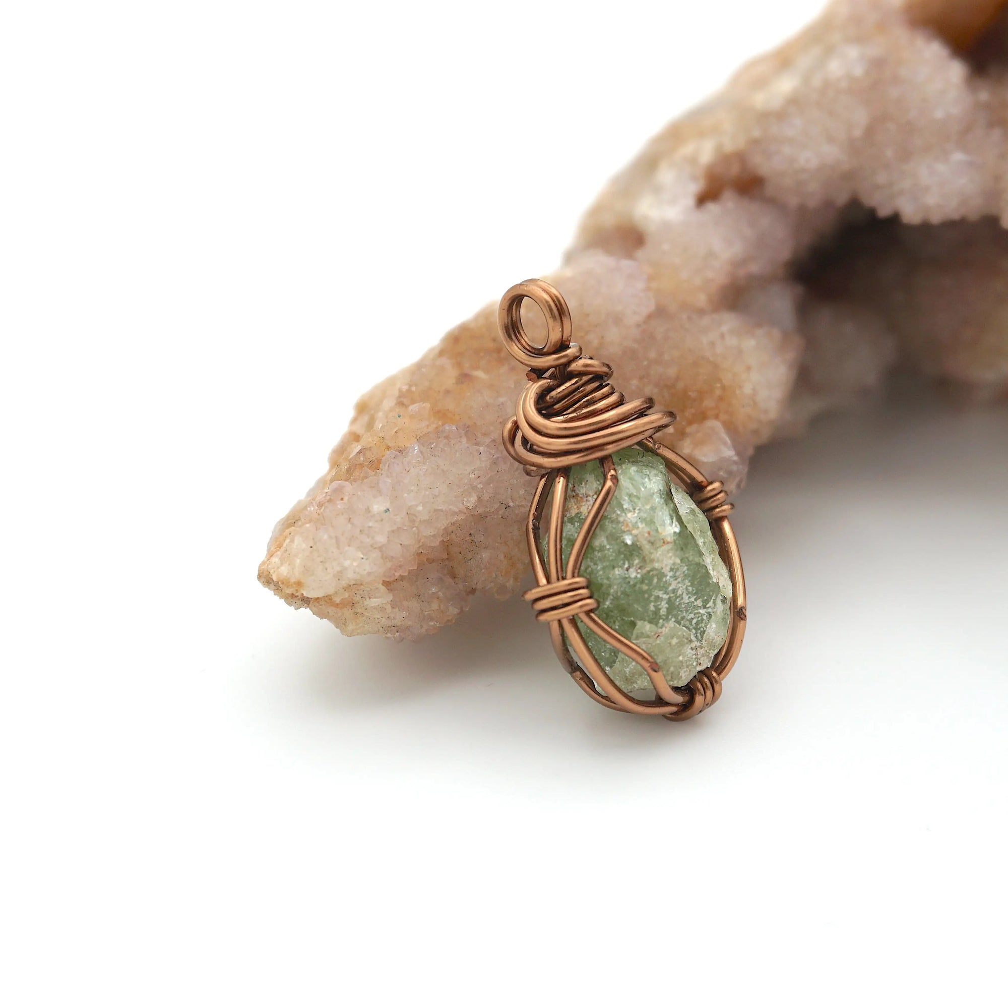 Right side detail of handmade raw peridot pendant — antique bronze wire wrapping technique, artisan crystal necklace