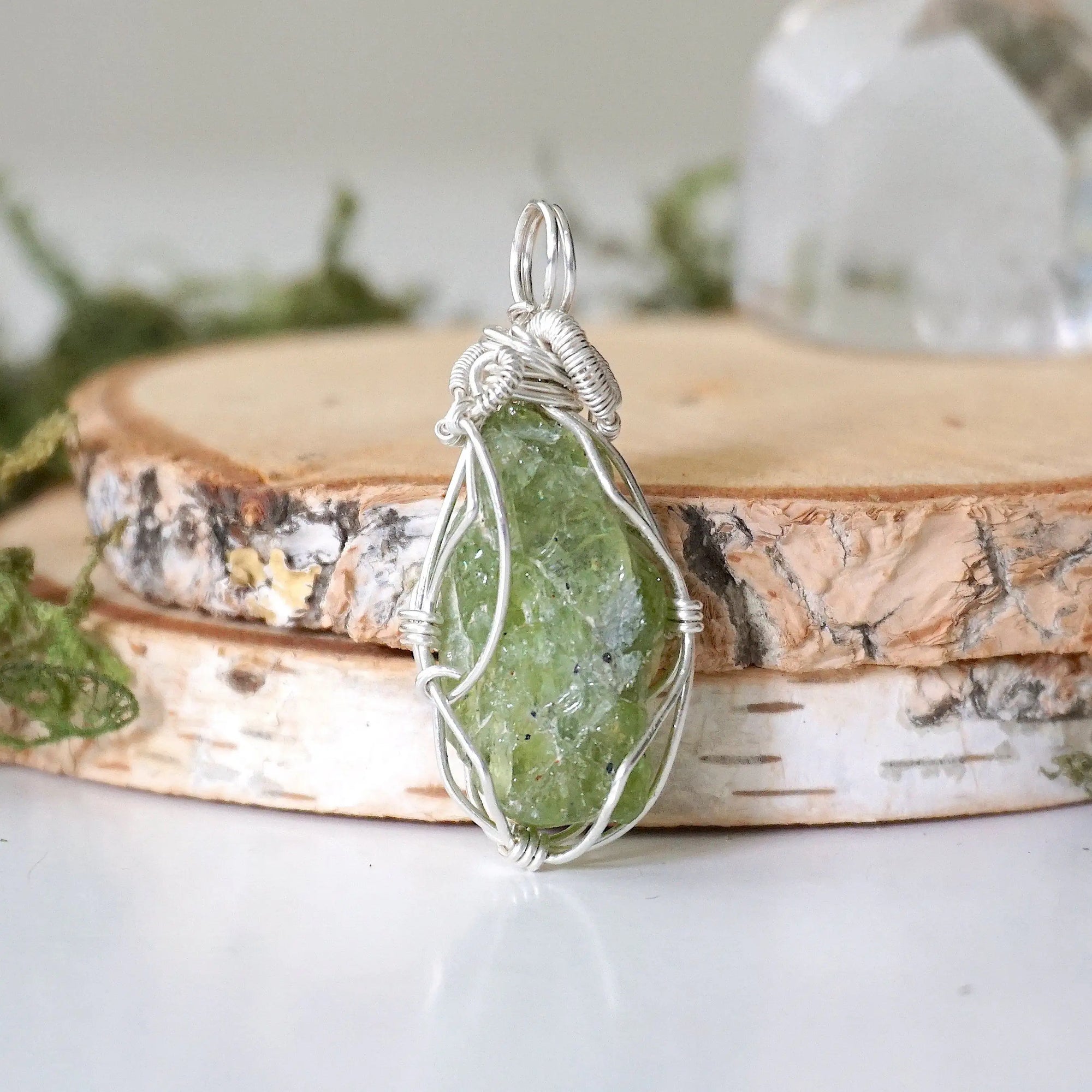Back view of raw peridot wire wrapped pendant for women — 925 sterling silver wire weave detail, handcrafted artisan crystal necklace, August birthstone jewelry