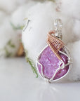 Side view of raw pink ruby pendant in sterling silver and 14k rose gold filled, showing artisan wire wrapping. Handcrafted July birthstone necklace by Designs by Nature Gems.