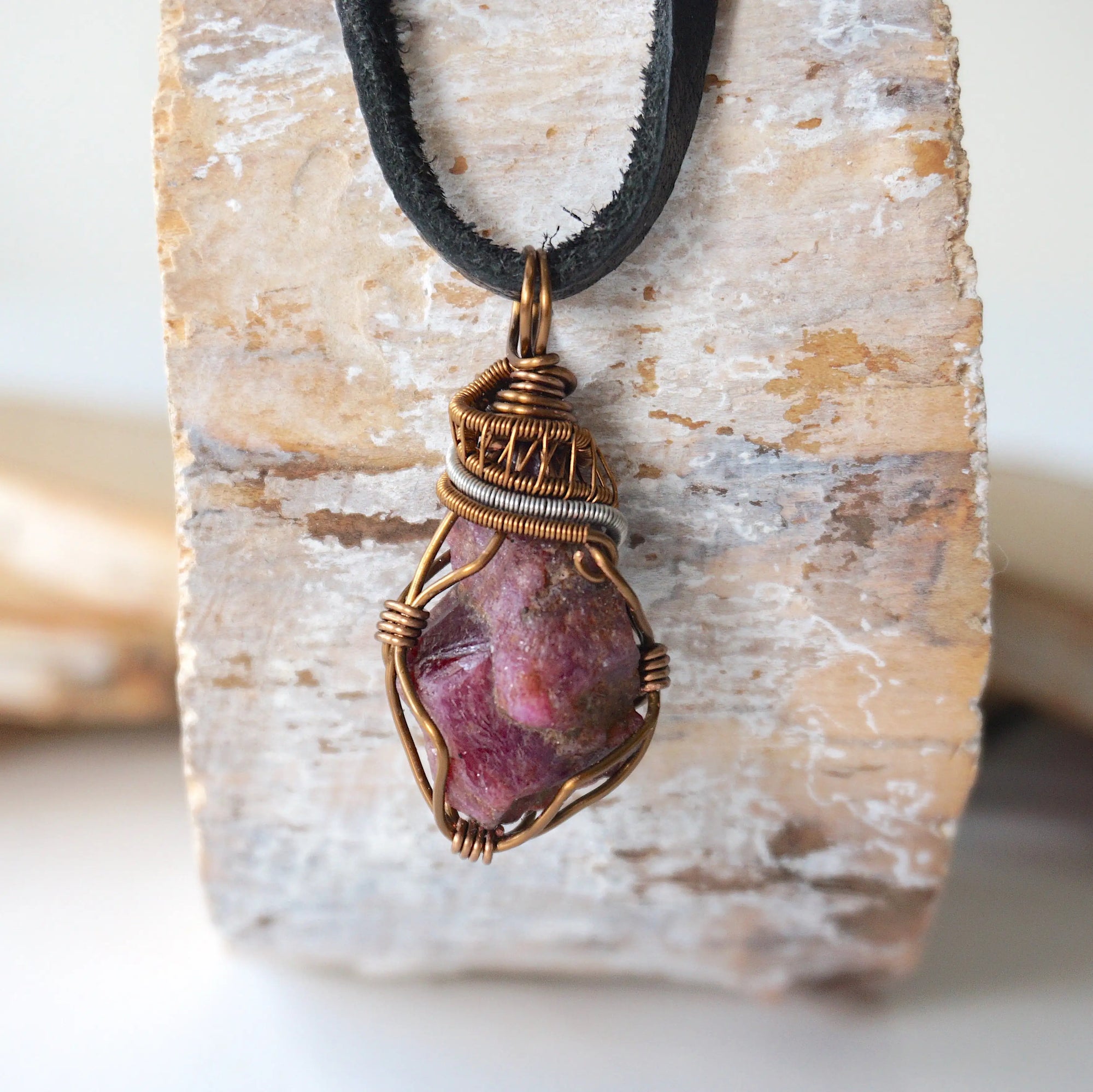 Raw ruby necklace for men with bronze and silver wire wrapped pendant on black leather cord — handmade crystal jewelry by Designs by Nature Gems