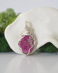 Back view of raw ruby wire wrapped pendant — 925 sterling silver hand-wrapped setting, shows craftsmanship and secure stone hold, handmade in Toronto Canada