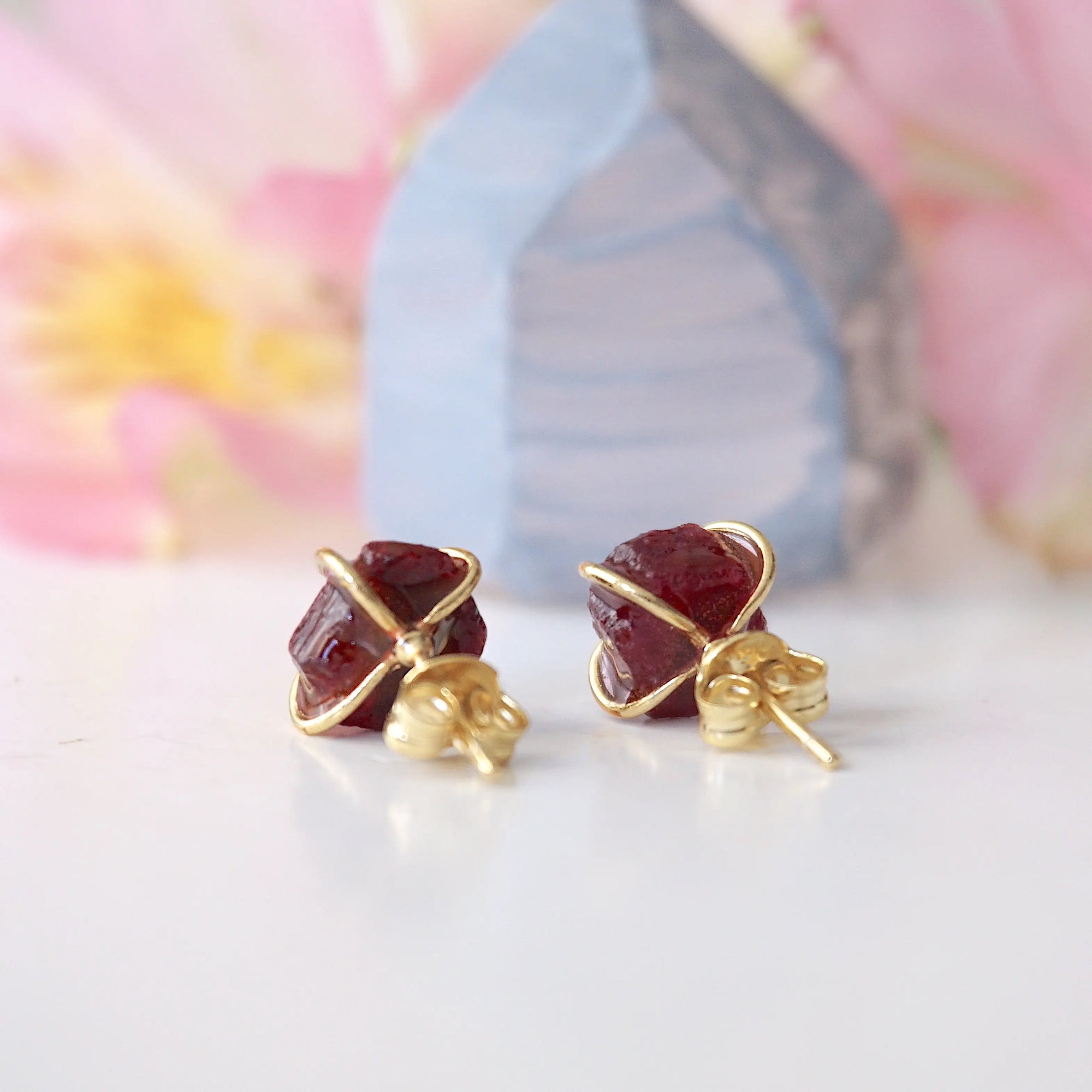 Back view of raw ruby prong stud earrings showing 14k gold vermeil posts and butterfly closure — natural crystal earrings quality detail