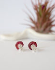 Back view of raw ruby stud earrings showing 925 sterling silver posts and butterfly backs — natural crystal earrings detail