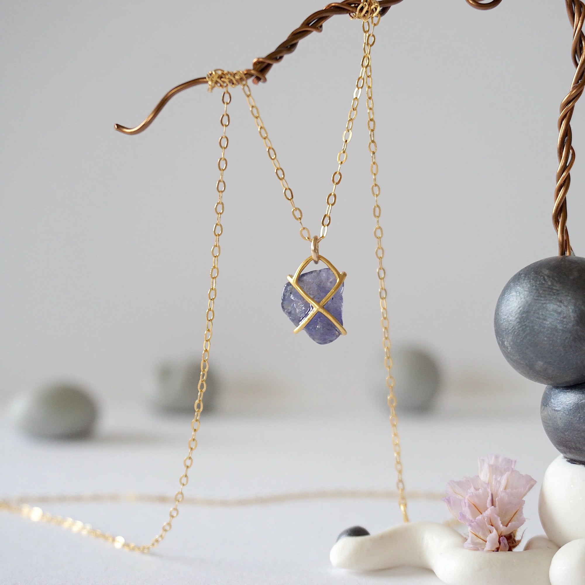 Back-angle view of raw sapphire pendant showing gold vermeil prong setting construction — 14k gold-filled chain, handcrafted by Designs by Nature Gems