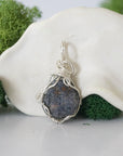 Back view of raw sapphire wire wrapped pendant — 925 sterling silver hand-wrapped setting, shows craftsmanship and secure stone hold, handmade in Toronto Canada