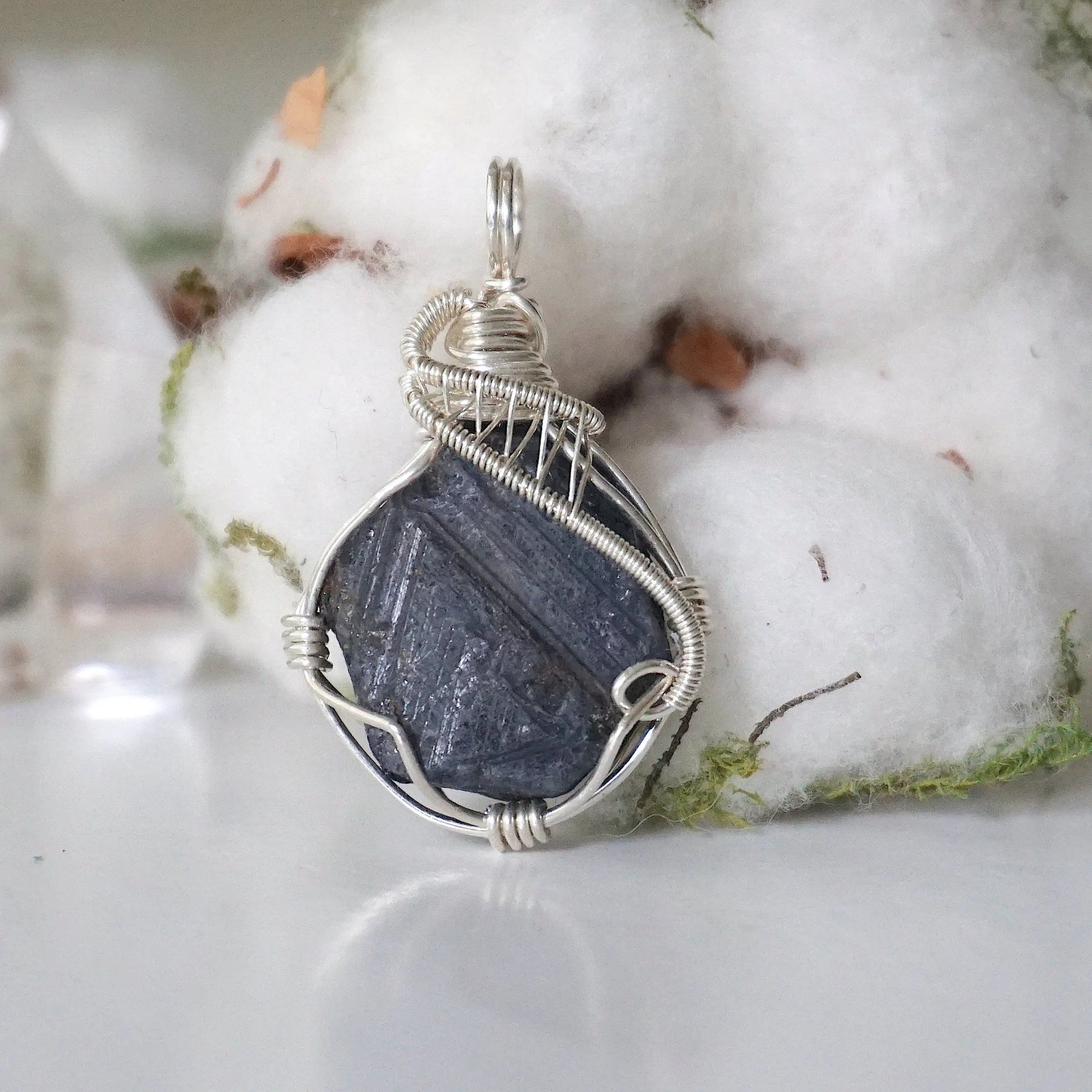 Front view of raw sapphire pendant in 925 sterling silver wire wrap — women's handcrafted crystal jewelry by Designs by Nature Gems