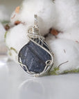 Front view of raw sapphire pendant in 925 sterling silver wire wrap — women's handcrafted crystal jewelry by Designs by Nature Gems