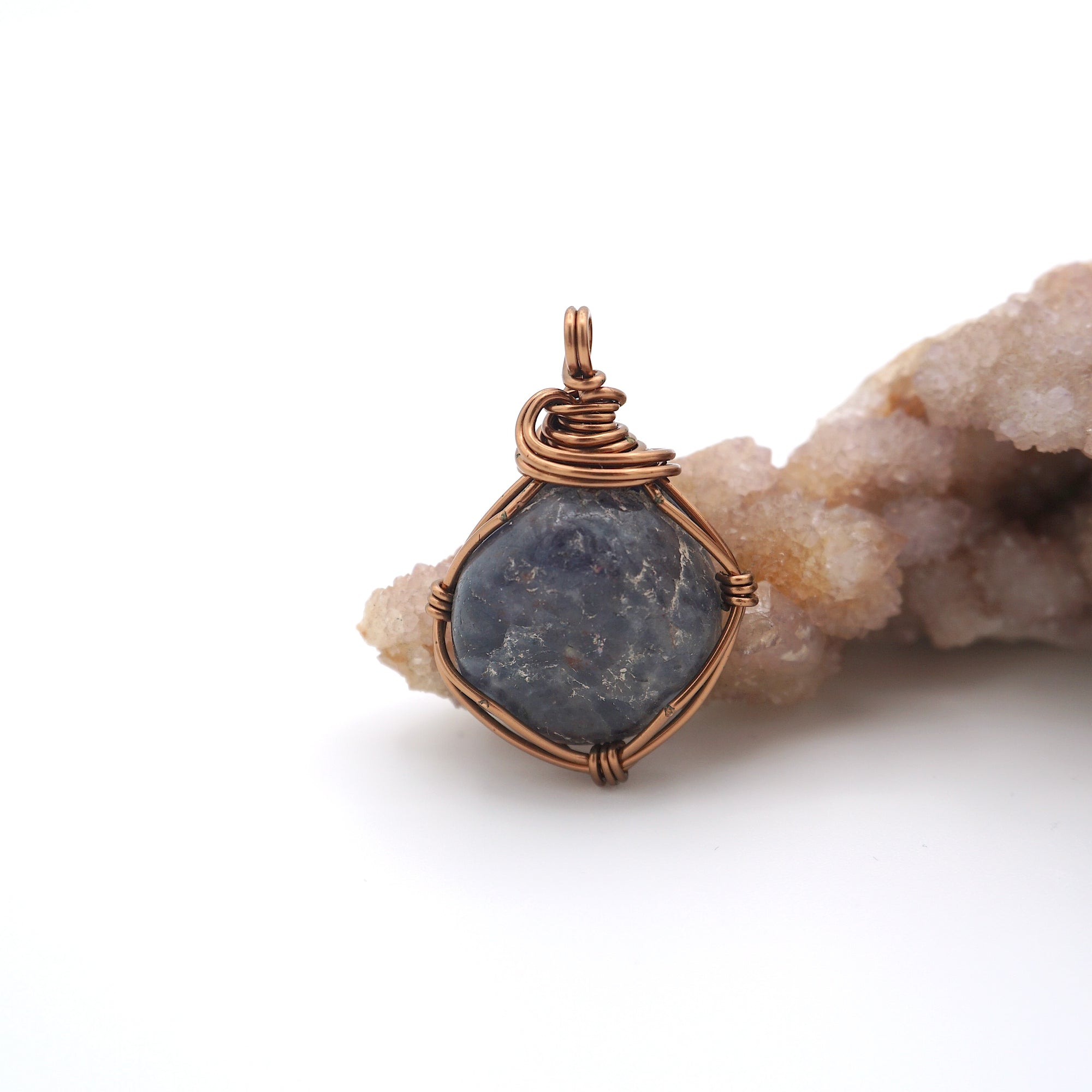 Front view of a raw sapphire pendant wire wrapped in antique bronze — natural crystal necklace handcrafted in Toronto