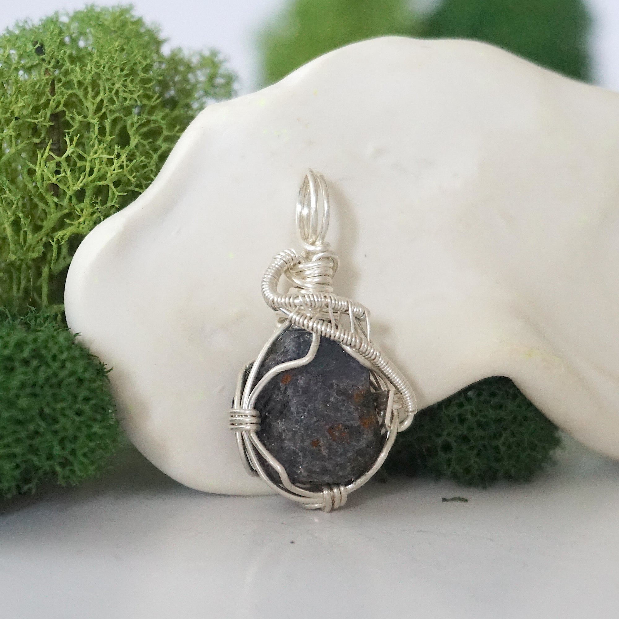 Right side detail of raw sapphire crystal pendant — intricate 925 sterling silver wire weaving technique, handcrafted artisan wire wrapped jewelry, Designs by Nature Gems