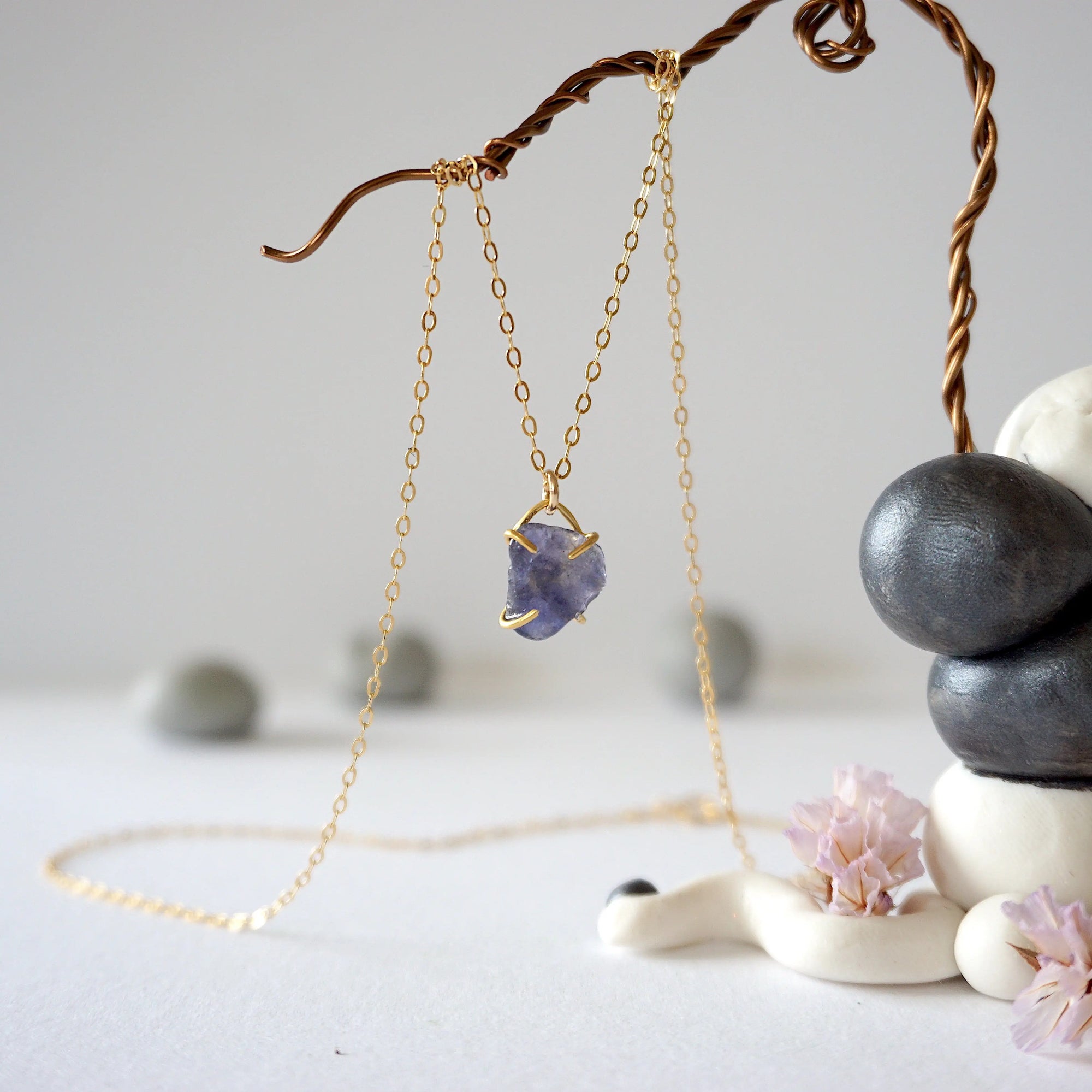 Side-angle detail of raw sapphire pendant in a minimalist gold vermeil prong setting — delicate handcrafted crystal necklace by Designs by Nature Gems