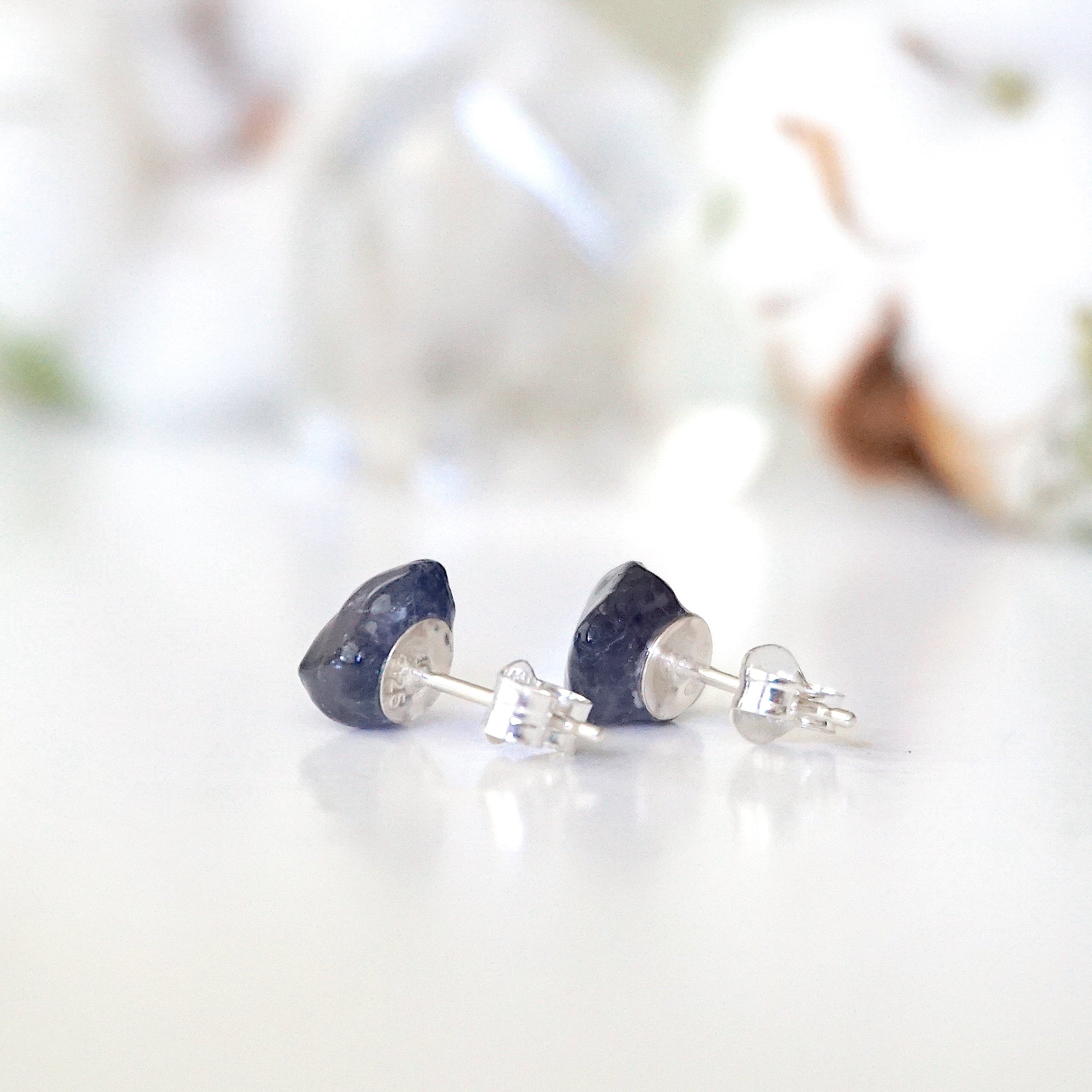 Back view of raw sapphire stud earrings showing the 925 sterling silver posts and earring backs