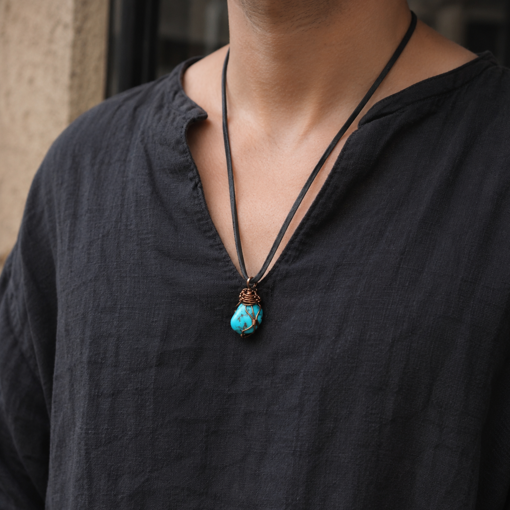 Model wearing raw turquoise necklace on leather