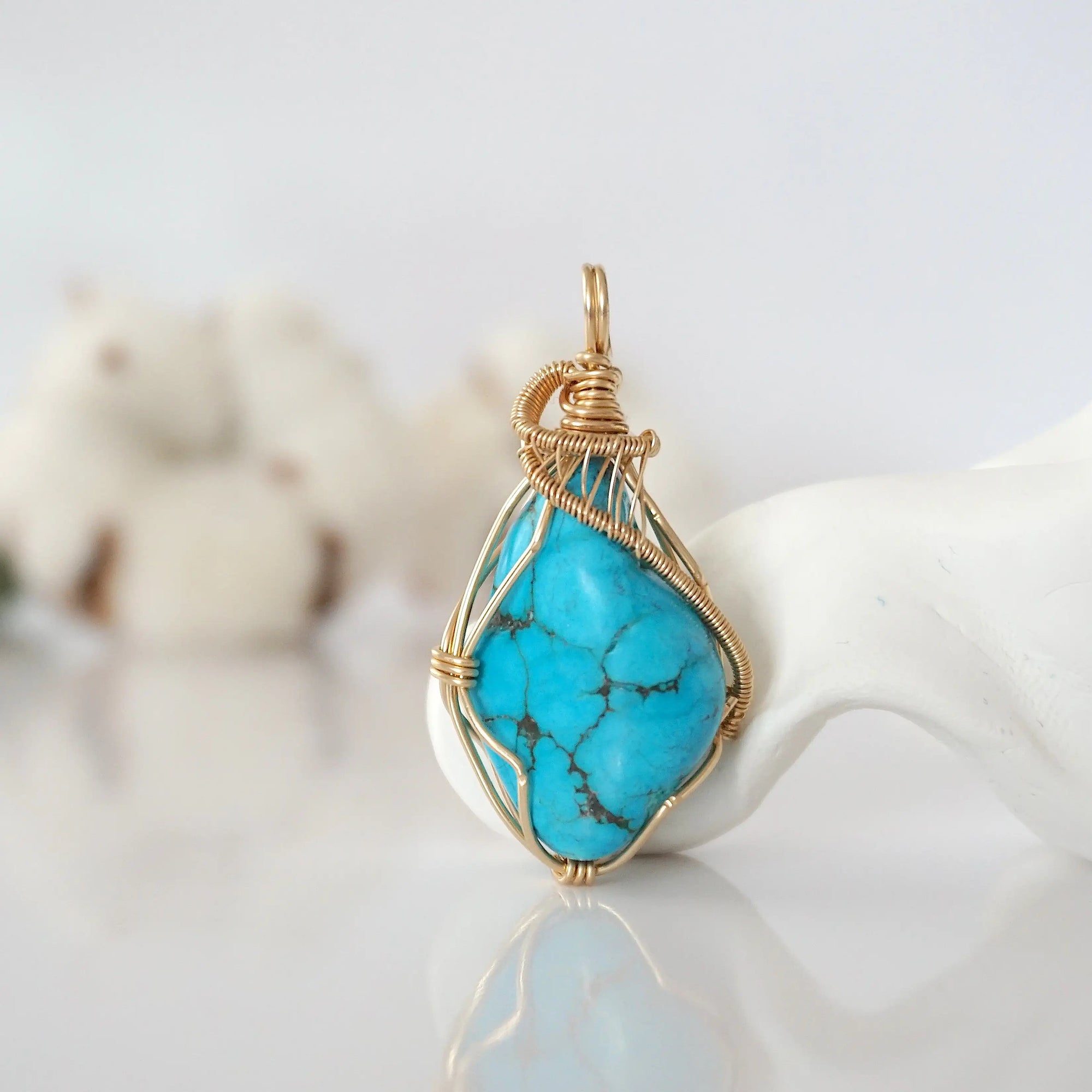 Detailed front view of raw turquoise pendant in 14k gold filled. Unique wire wrapped December birthstone jewelry by Designs by Nature Gems.