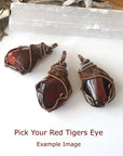 Three natural red tiger's eye pendants showing stone variation in size, shape, and color, artisan jewelry by Designs by Nature Gems.