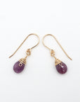 Side angle of ruby drop earrings, minimalist artisan wire wrapping, 14k gold filled