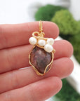 Ruby and freshwater pearl necklace pendant in hand for size reference, artisan birthstone jewelry gift for her
