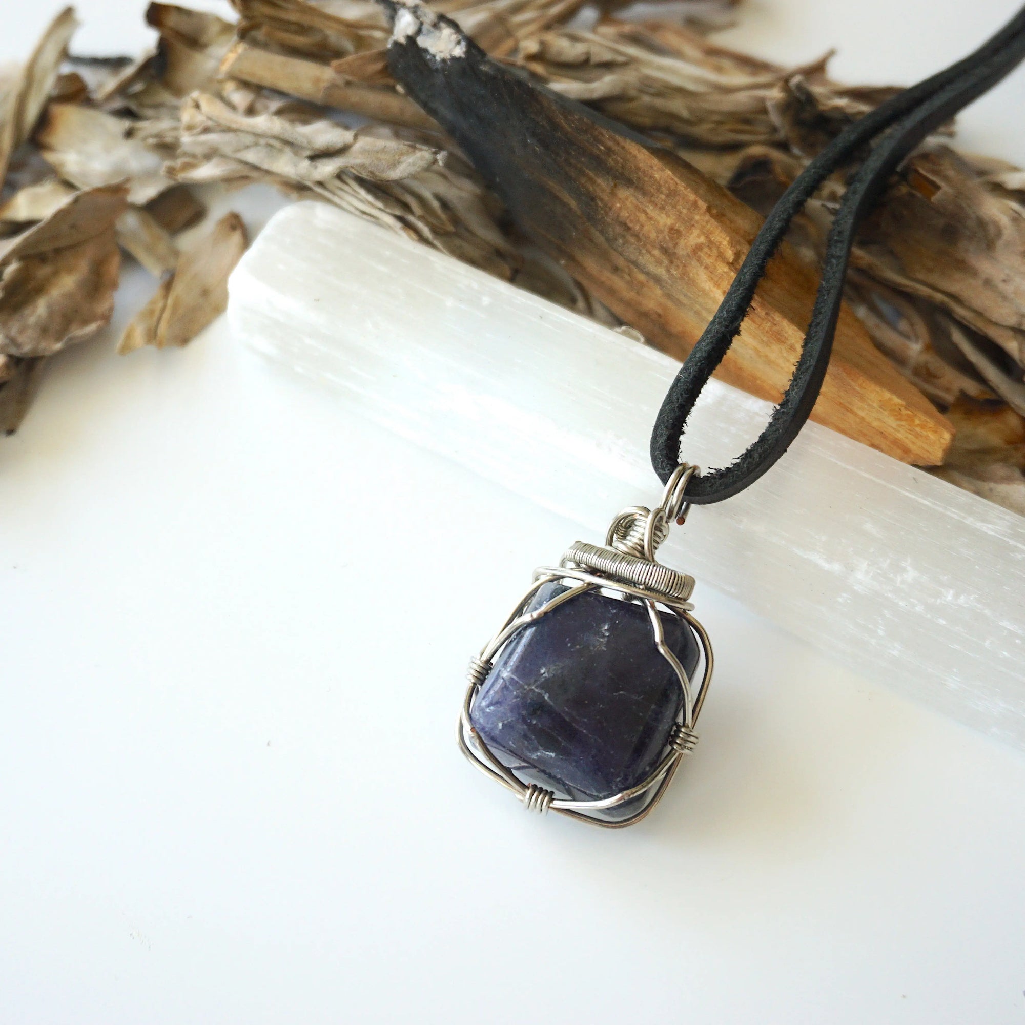 Natural sapphire necklace on a genuine black leather cord — dark silver wire wrap, handcrafted crystal jewelry by Designs by Nature Gems